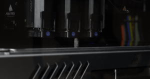 MMJ ProX3 print heads producing a multi-material 3D printed part in a single build.