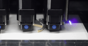 MMJ ProX3 print heads producing a multi-material 3D printed part in a single build.