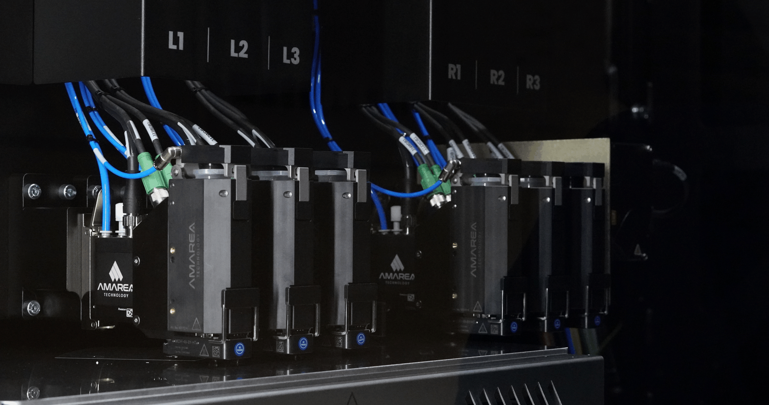 Detailed interior view of the build chamber with six installed print heads.